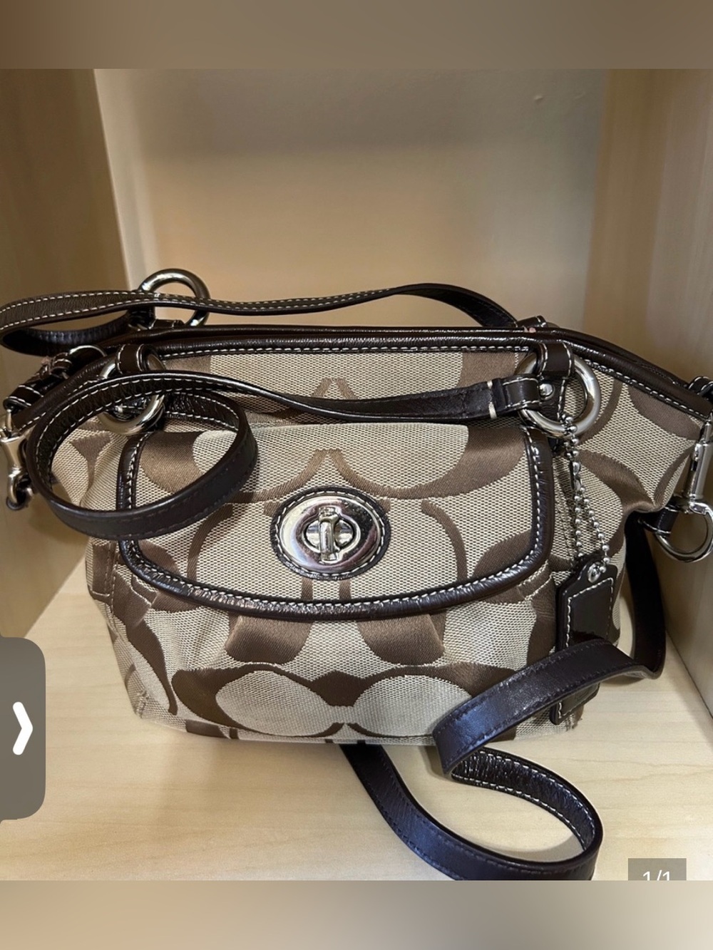 Coach Leah Signature shoulder tote features the iconic brown monogram canvas EUC